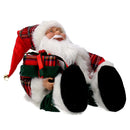 Babbo natale in tessuto rosso seduto con regali, musica e movimento cm xh35,5