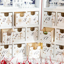 Calendario Avvento di Natale a forma di Libro 22x9x30 cm con Scritte e Motivi a Tema Bianco